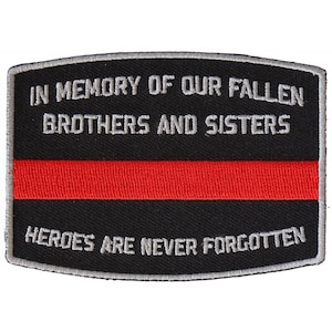 May include: Black and red embroidered patch with the text "In Memory of Our Fallen Brothers and Sisters Heroes Are Never Forgotten".