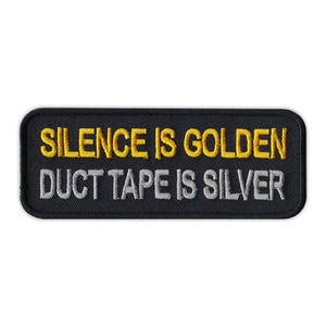 May include: Black embroidered patch with the text "Silence is Golden Duct Tape is Silver" in yellow and silver thread.