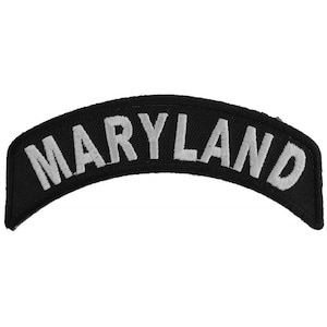 May include: Black and white embroidered patch with the word "MARYLAND" in white lettering.