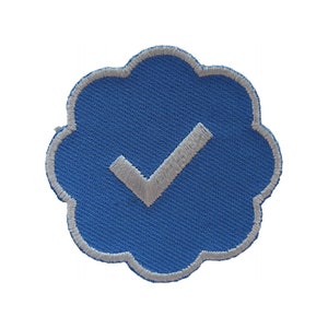 May include: A blue and white embroidered patch in the shape of a cloud with a white checkmark inside.