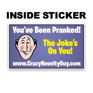 May include: A blue and yellow sticker with a cartoon man's face and the text "You've Been Pranked! The Joke's On You! www.CrazyNoveltyGuy.com".