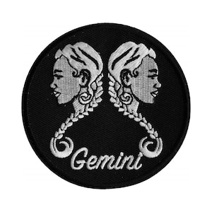May include: A black embroidered patch with a white outline of two female faces, the word "Gemini" is written below the faces.