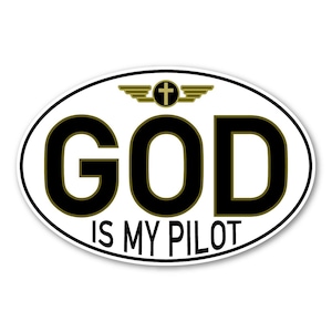 May include: White oval sticker with a black outline. The sticker has a gold cross with wings and the text "GOD IS MY PILOT" in black.
