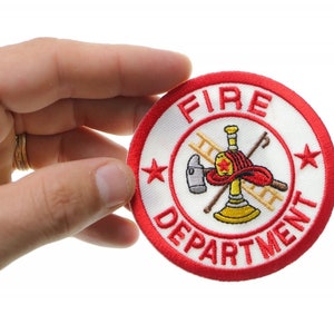 May include: A red and white embroidered patch with the words "FIRE DEPARTMENT" and a firefighter's helmet, axe, ladder, and hose.