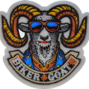 May include: A white embroidered patch with a biker goat wearing sunglasses and a blue denim jacket. The goat has large yellow horns and a red mouth. The patch has the text "Biker Goat" in a banner.