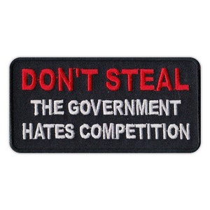 May include: Black embroidered patch with white and red text that reads "DON'T STEAL THE GOVERNMENT HATES COMPETITION".