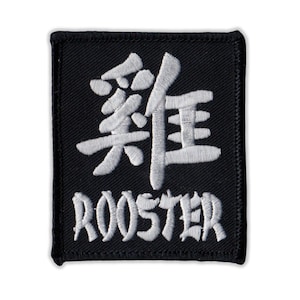 May include: Black square patch with white embroidered Japanese characters and the word "ROOSTER" below. The patch has a stitched border and is likely an iron-on or sew-on patch.