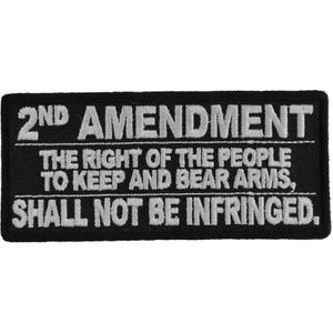May include: Black rectangular patch with white embroidered text. The text reads "2ND AMENDMENT" above "THE RIGHT OF THE PEOPLE TO KEEP AND BEAR ARMS, SHALL NOT BE INFRINGED."