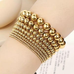 14 kt geelgouden kralenarmband - stapelbare armband - armband met stretchkralen - kralenarmband