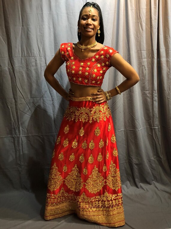 golden gown with red dupatta