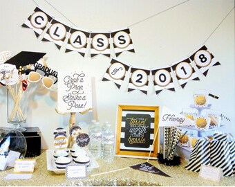 May include: Black and gold graduation party decorations with a banner that says "Class of 2018", cupcakes, and a sign that says "The tassel was worth the hassle".