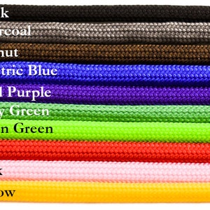 May include: A close-up of 10 different colors of paracord, including black, charcoal, walnut, electric blue, acid purple, kelly green, neon green, red, pink, and yellow.