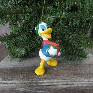 Donald Duck with Gift Ornament Walt Disney Company Plastic Christmas Donald with Green and Red Hat