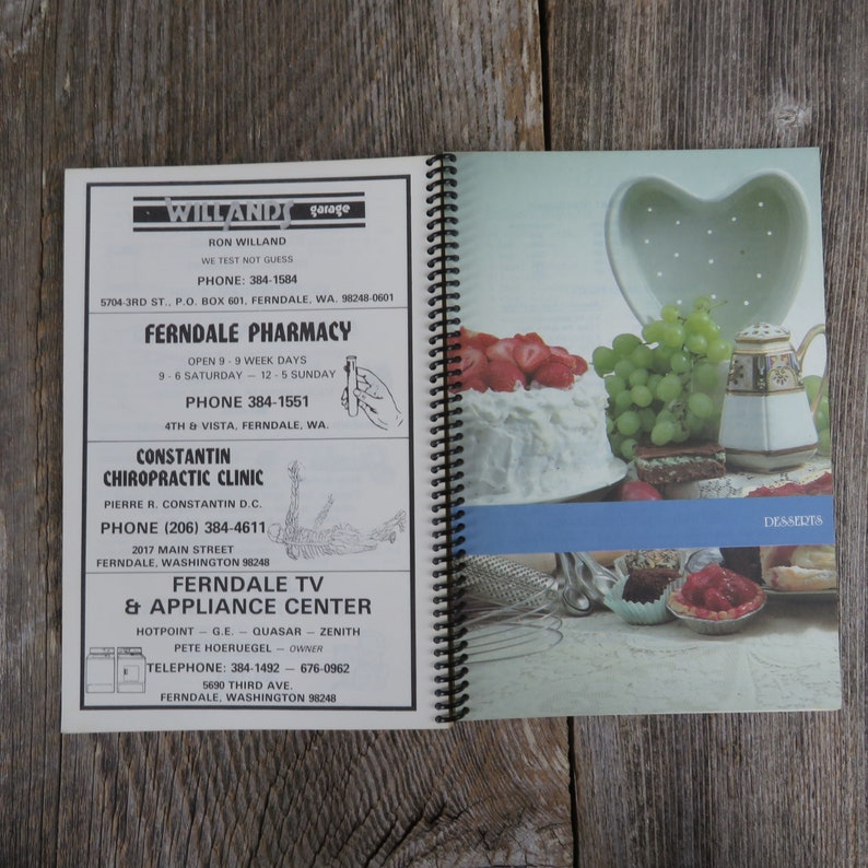 May include: A white and blue business card with the text "Willandt Garage" and contact information for Ron Willandt, Ferndale Pharmacy, Constantin Chiropractic Clinic, and Ferndale TV & Appliance Center.