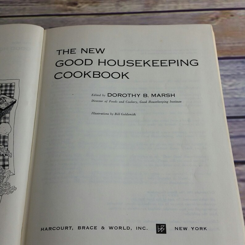 May include: The cover of a vintage cookbook titled "The New Good Housekeeping Cookbook" edited by Dorothy B. Marsh, Director of Foods and Cookery, Good Housekeeping Institute. The book was published by Harcourt, Brace & World, Inc. and features illustrations by Bill Goldsmith.