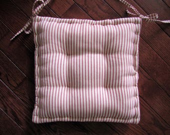 Dining chair pad with ties; Custom chair cushion made in red and white ticking stripe; Tufted chair pad with French quilted edges