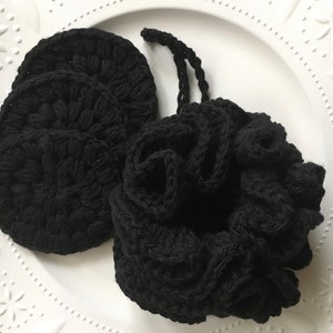 May include: Three black crocheted makeup remover pads and a black crocheted scrunchie.