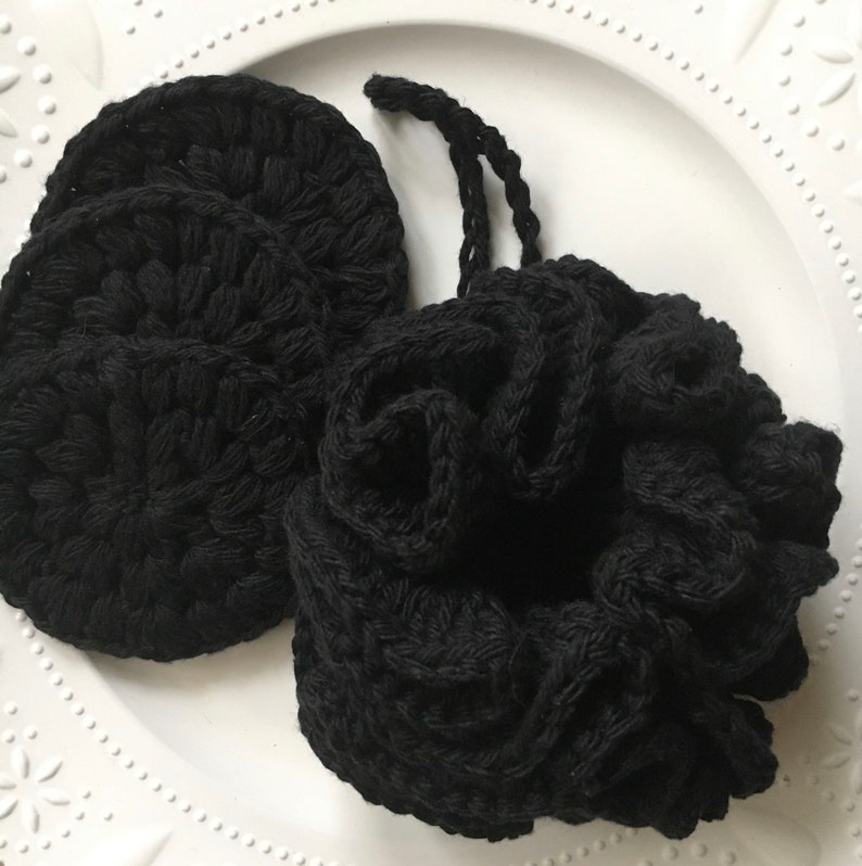 May include: Three black crocheted makeup remover pads and a black crocheted scrunchie.