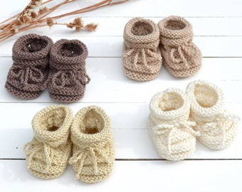 Knitted baby booties . Gender neutral new parents gift from grandmother . Pregnant sister gift