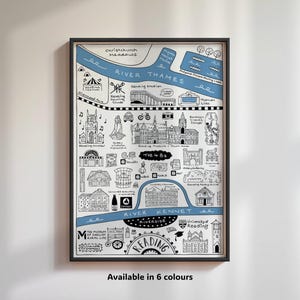 May include: A black and white illustrated map of Reading, England, with blue accents. The map features landmarks, businesses, and points of interest, including the River Thames, the River Kennet, and the University of Reading. The text "Reading" is prominently displayed in the centre of the map.