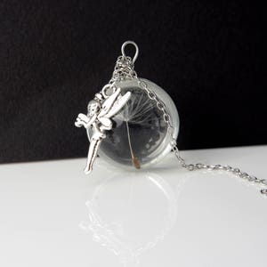 Wensketting paardenbloem: echt paardebloemzaad in glazen bol