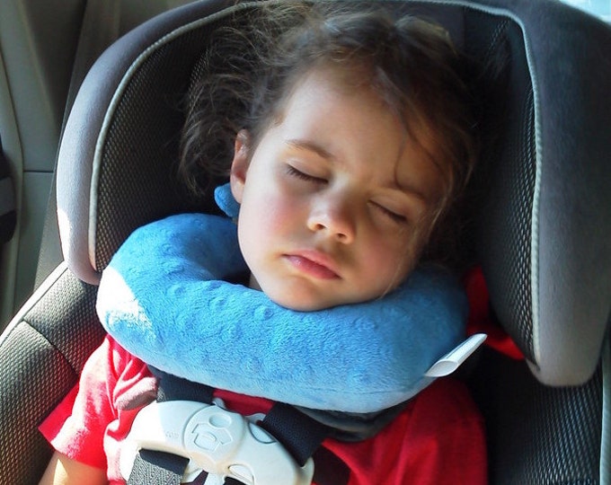 A Travel Pillow for Children in Forward Facing Car Seats That Offers Chin and Head Support. This