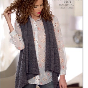 May include: A woman wearing a dark gray knitted vest over a floral blouse and jeans. The vest has a unique openwork design. The image includes text that reads "NORO NSL023 SILK GARDEN SOCK SOLO" with measurements of 28-46 inches.