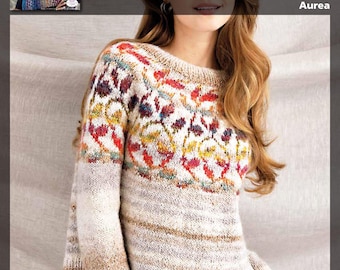 Könnte beinhalten: Eine Frau trägt einen cremefarbenen Pullover mit einem bunten Blumenmuster auf der Vorderseite. Der Pullover hat lange Ärmel und einen Rundhalsausschnitt. Die Frau trägt eine rote Hose und hat lange braune Haare.