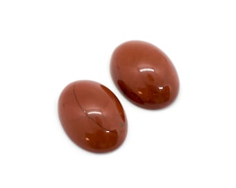 May include: Two oval-shaped red jasper cabochons, each with a smooth, polished surface and subtle brown striations.