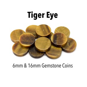 May include: A pile of round, brown and gold tiger's eye gemstone coins. The coins are 6mm and 16mm in diameter.  "Tiger Eye" is written above the coins and "6mm & 16mm Gemstone Coins" is written below.
