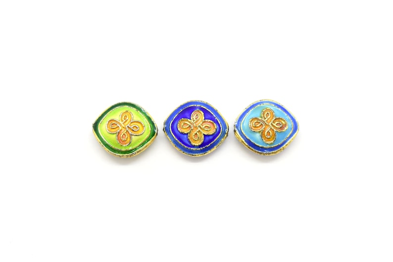 May include: Three enamel beads with gold trim and a floral design. The beads are green, blue, and light blue.