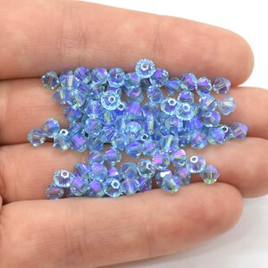 thumbnail image 2 of 98 Pieces 4mm Aqua Blue Crystal Glass Bicone Beads – Spacer Beads 2 of 6
