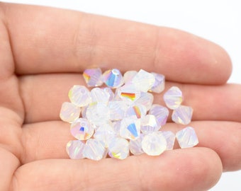 Cuentas bicono de cristal checo Preciosa con purpurina de ópalo blanco, 4 mm (24 unidades) y 6 mm (18 unidades), venta al por mayor, compatibles con cristales Swarovski 5301/5328.