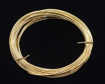 May include: A coil of gold-colored wire, perfect for jewelry making or crafting projects.