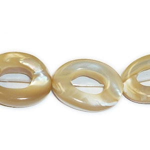 May include: A strand of beige and white oval-shaped shell beads with a hole in the center. The beads are strung on a clear thread.