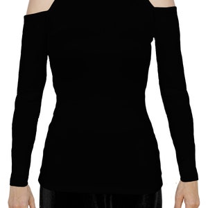 May include: A black long-sleeved top with a mock turtleneck and cold shoulder cutouts. The top is form-fitting and made of a smooth, solid black fabric. The sleeves are long and fitted, and the shoulders are exposed.