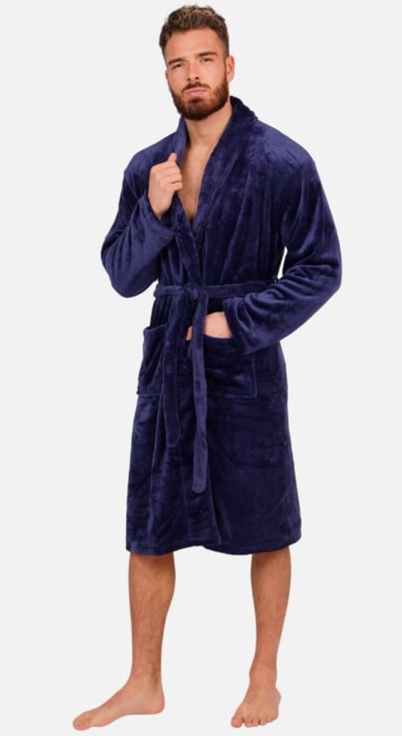 May include: A dark blue plush robe with a shawl collar and a tie belt.