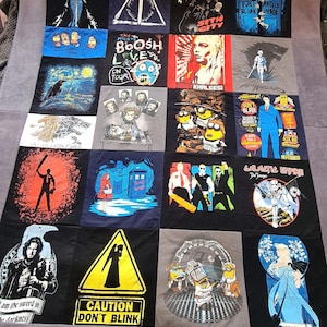 May include: A quilt made from a variety of t-shirts featuring popular culture references. The quilt is made up of 16 squares, each with a different design. Some of the designs include the Star Wars logo, the Game of Thrones logo, the Doctor Who logo, and the Minions. The quilt is a great way to show your love for your favourite fandoms.