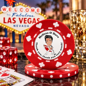 May include: A red casino poker chip featuring a white center inlay with a cartoon illustration of a singer in a white jumpsuit, the text Melissa & Dave, and the phrase Thank you, thank you very much, surrounded by white card suit symbols.
