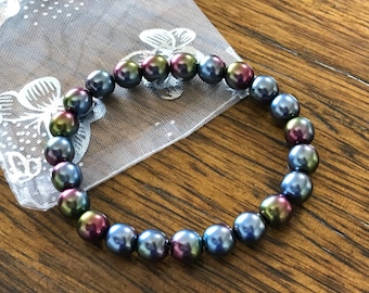 Peacock colored pearls | Etsy