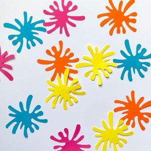 Puede incluir: Una colección de recortes de papel de colores en forma de salpicaduras. Los colores incluyen rosa, naranja, amarillo, azul y turquesa.