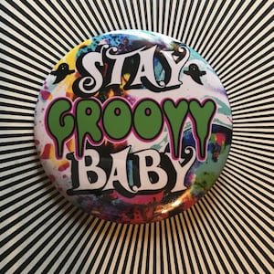 Stay groovy baby!  2.25 inch pin