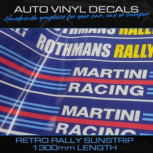 May include: A blue and white retro rally sunstrip decal with the text "Rothmans Rally", "Martini Racing", and "Retro Rally Sunstrip 1300mm Length".