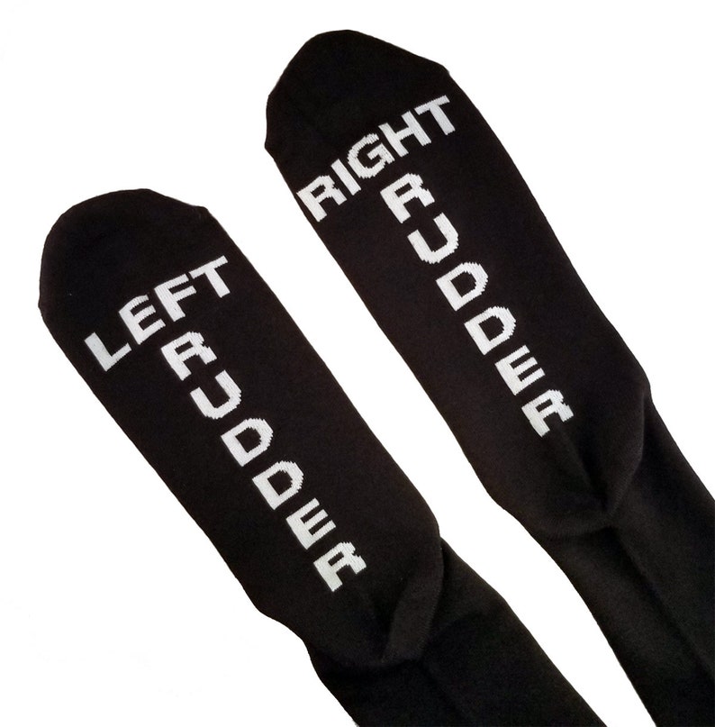 May include: A pair of black socks with white text. The left sock says "LEFT RUDDER" and the right sock says "RIGHT RUDDER".
