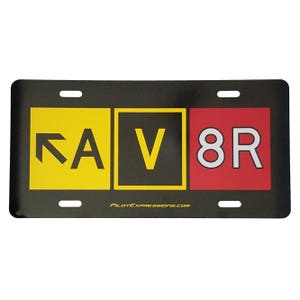 May include: Black license plate with yellow, black, and red squares. The yellow square has a black arrow and the letter A. The black square has the letter V. The red square has the numbers 8 and the letter R. The website PilotExpressions.com is printed at the bottom.