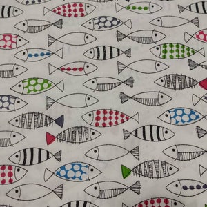 May include: White fabric with a repeating pattern of black outlined fish with various colored polka dots, stripes, and solid colors.