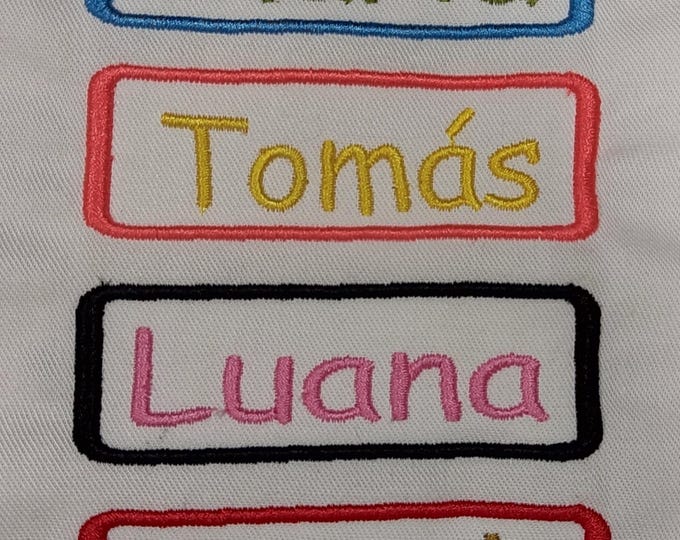 Embroidered names to apply to bibs, clothes, bags, etc... different colors to choose from