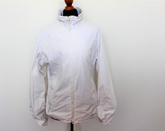 May include: A white lightweight jacket with a zipper closure and a small logo on the bottom right side.