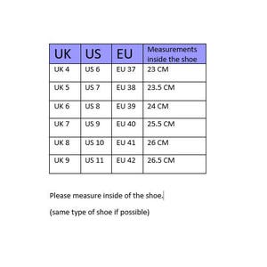 May include: A white chart with shoe size conversions from UK and US to EU sizes. Measurements inside the shoe are in centimeters, ranging from 23 cm to 26.5 cm. The text at the bottom says to measure inside the shoe.