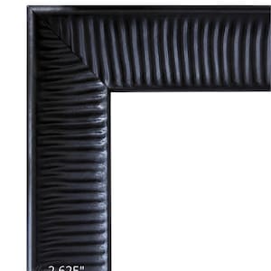 May include: A black picture frame with a textured, rippled surface pattern. The frame features a mitered corner joint and a clear measurement indicator showing a width of 2.625 inches. The design consists of vertical, wavy ridges along the border.